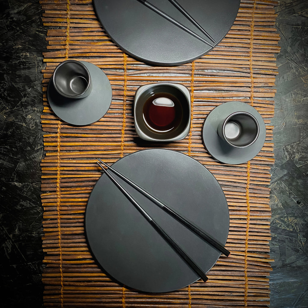 handmade black concrete coaster set and placemats tableware lifestyle