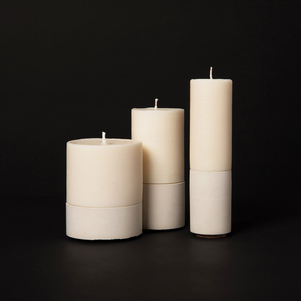 concrete and wax handmade pillar candles and concrete candle holders modular stackable unique design