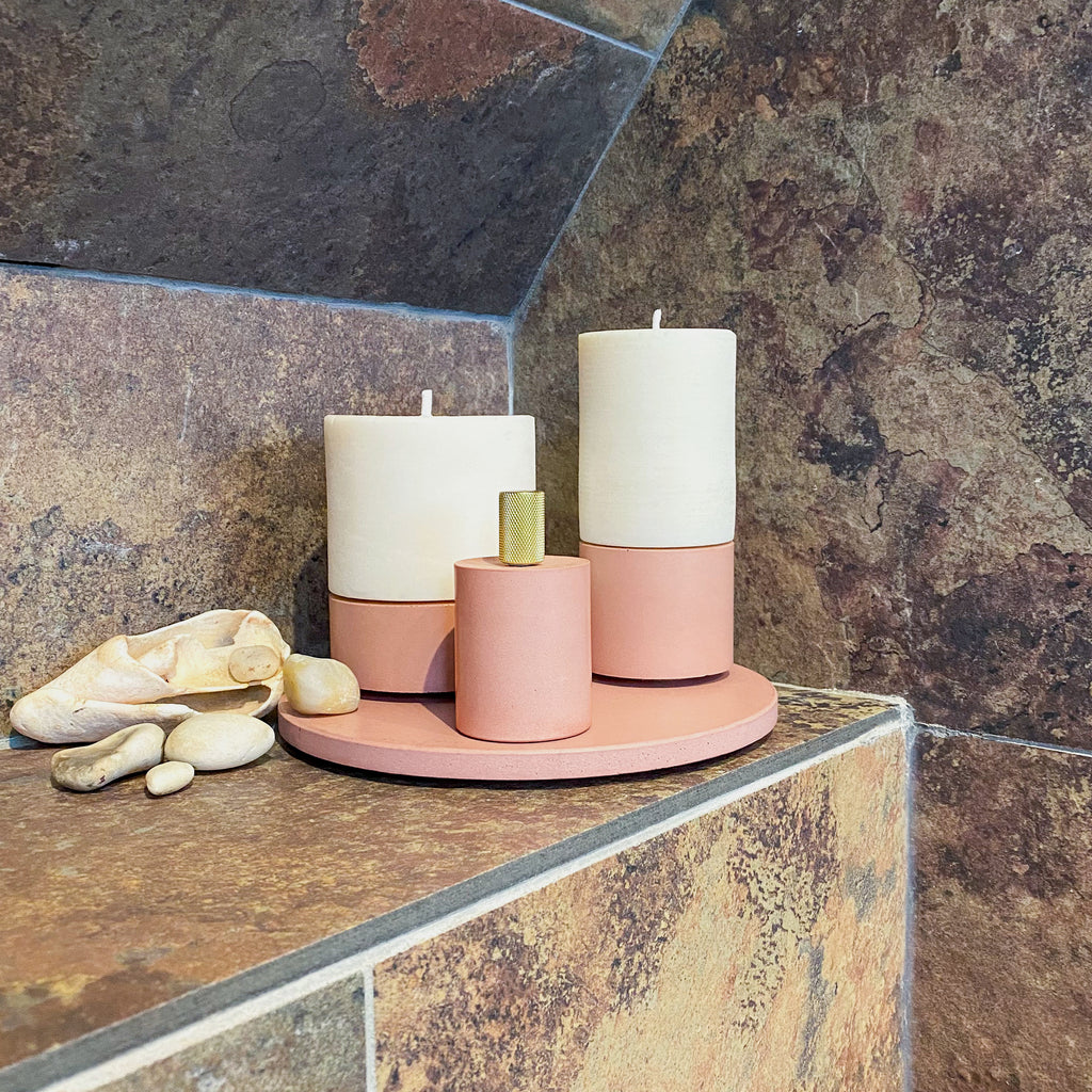 blush handmade concrete candle holders and fragranced candles and candle snuffer lifestyle bathroom