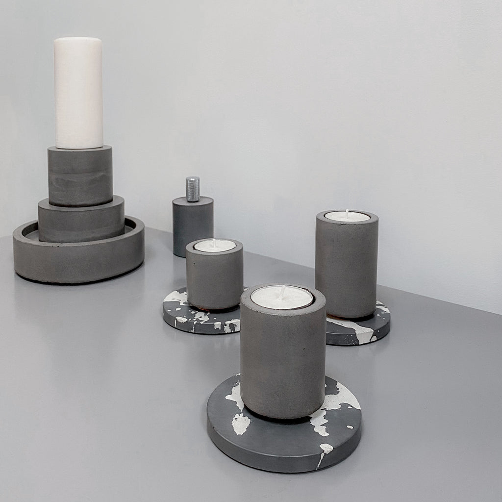 grey and white handmade splatter concrete coasters and stackable candle holders